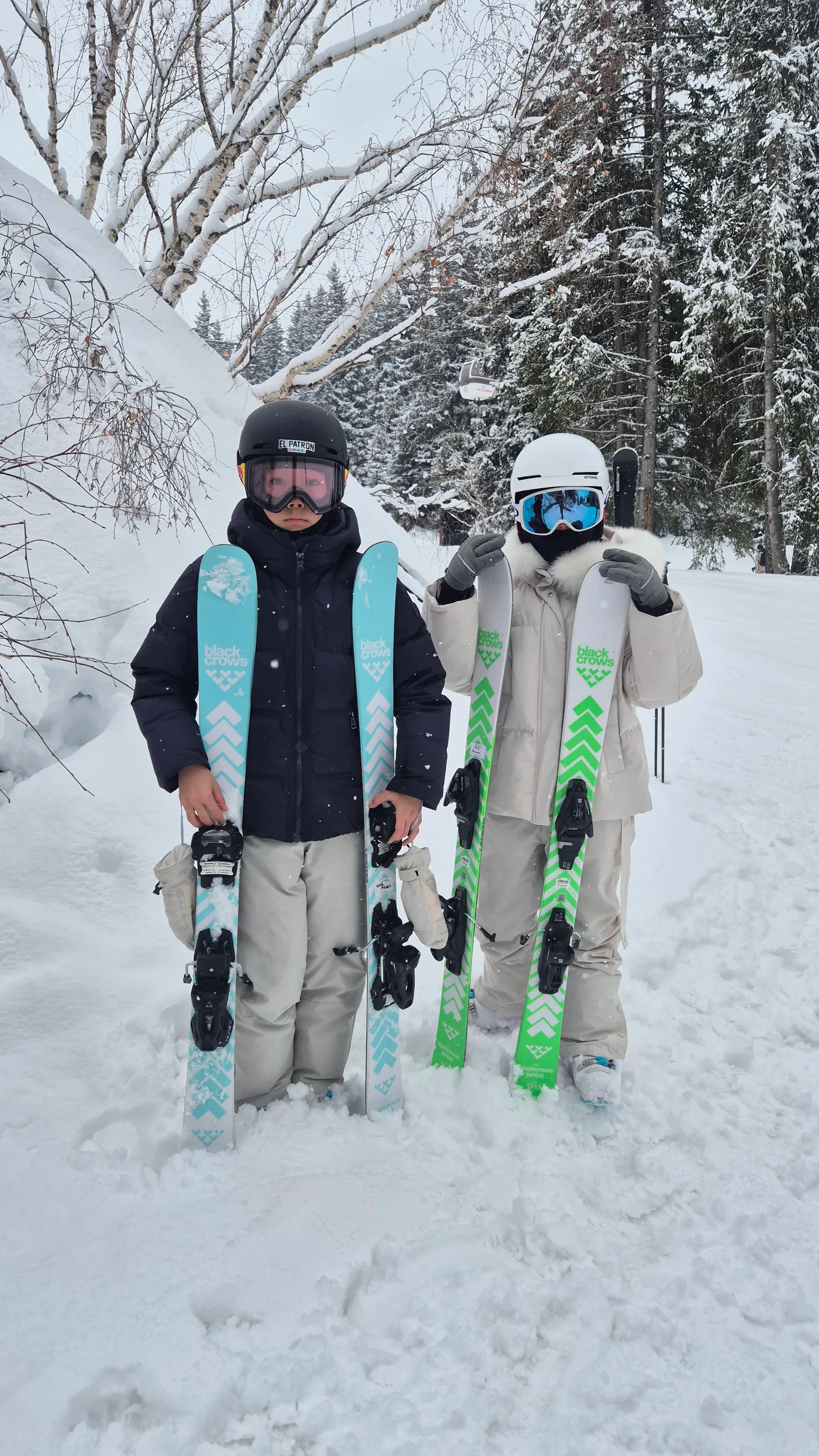 Two skiers in a snowy mountain landscape